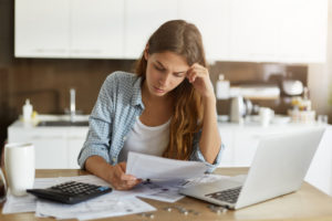 woman struggling with debt